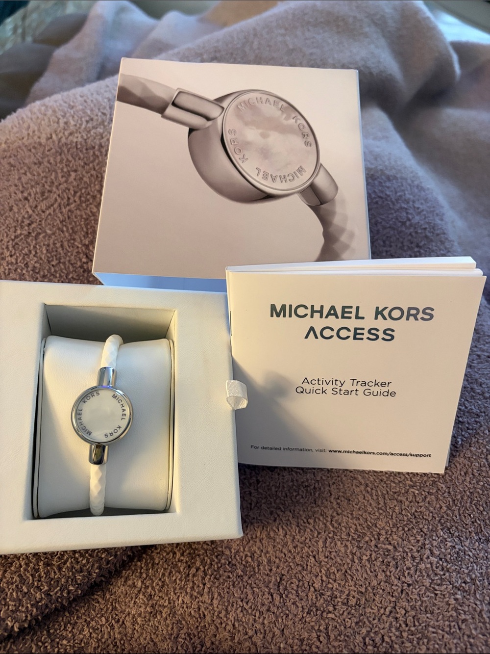 Michael Kors white braided activity tracker with silver-tone case